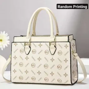 Elegant cream monogram tote bag with gold-tone hardware and top handles