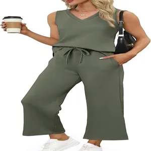 Casual two-piece summer travel set with olive green V-neck vest and wide-leg pants.
