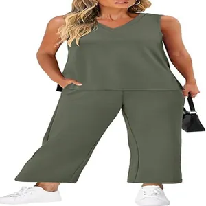 Full body shot of a woman in a green V-neck tank top and matching wide-leg pants set