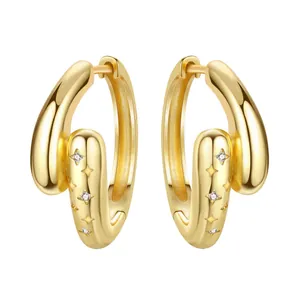 Detail view of 18K gold plated hoop earrings with star-set cubic zirconia stones.