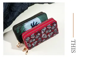 Detailed view of Halloween skull and zombie prints on double zipper long wallets