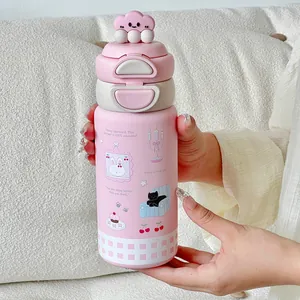Close-up of a pink cartoon 316 stainless steel vacuum flask being held in hands