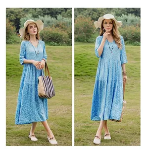 Detailed view of an elegant blue floral cotton silk midi dress with half sleeves and V-neck