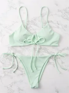 Detailed flat lay view of a mint green ribbed two-piece bikini set with tie strings