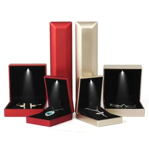 Premium LED light jewelry boxes for rings necklaces and bracelets in red and champagne gold