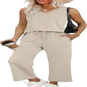 Women's elegant 2-piece summer travel set with beige V-neck tank top and wide-leg pants