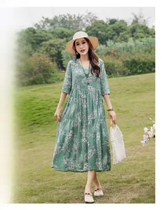 Elegant green paisley midi dress with half sleeves for summer casual beach wear.