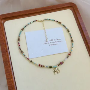 Handcrafted natural stone beaded necklace featuring a delicate golden elephant charm