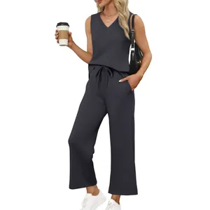 Detail of women's two-piece set featuring V-neck tank top and drawstring wide-leg pants