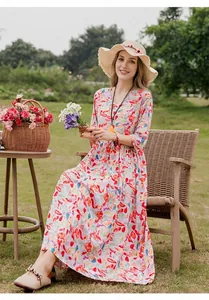 Elegant cotton silk floral maxi dress for summer shown in a scenic garden setting