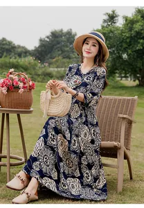 Elegant summer cotton silk floral maxi dress with mid-length sleeves and straw hat