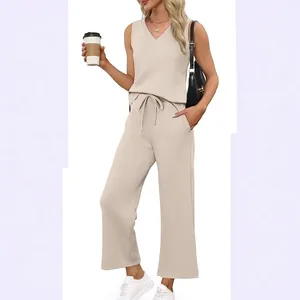 Casual beige women's summer 2-piece travel set with V-neck tank top and wide-leg pants