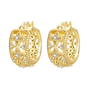 Detail of 18K gold plated hoop earrings featuring iris flower and star zircon stones