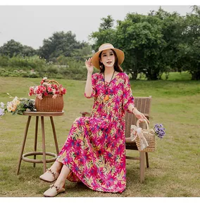 Detail of vibrant floral print cotton silk summer maxi dress for beach leisure