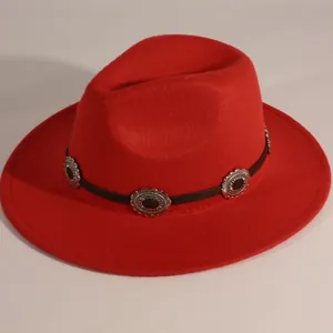 Side view detail of a classic red wool felt fedora with decorative leather band