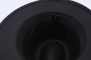 Macro detail view showing size 57 M care label inside black polyester felt fedora hat
