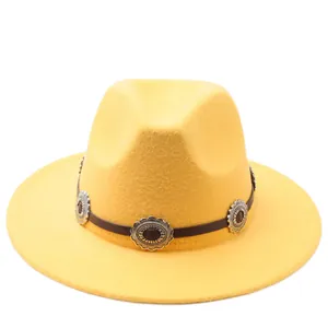 Classic yellow vintage felt fedora hat with decorative silver metal concho band and flat brim