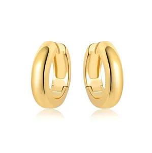 Detailed view of polished 18K gold plated thick hoop earrings with hinge closure