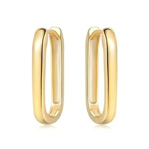 Macro view of 18K gold-plated U-shaped hoop earrings with a shiny high-polished finish