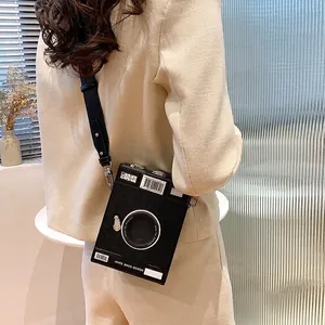 Vintage camera-shaped crossbody bag with creative design for stylish street wear.
