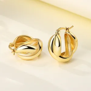 Detailed macro view of chunky 18K gold plated pleated hoop earrings in S925 silver