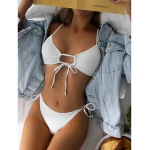 Sexy white ribbed triangle bikini set with front drawstring and denim jacket accent.