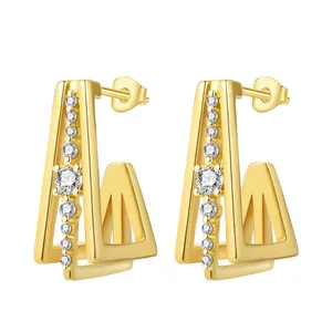 Detailed view of geometric 18K gold-plated hoop earrings featuring clear stones.