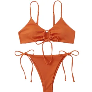 Two-piece orange ribbed bikini set with triangle top and side-tie bottoms
