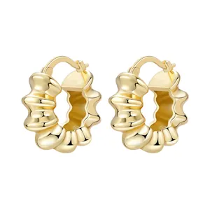 Macro view showing the textured scalloped design of 18K gold-plated hoop earrings