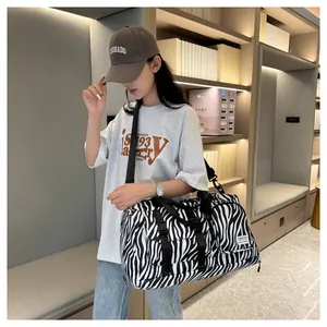 Stylish large zebra print gym bag for travel and fitness with adjustable shoulder strap