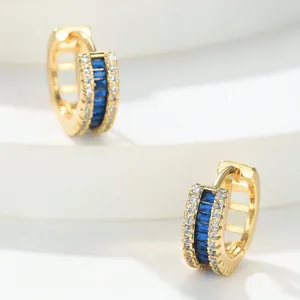 Gold-plated copper hoop earrings featuring blue baguette and clear round zircons