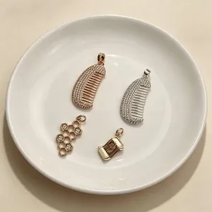 Gold and silver comb, honeycomb, and dollar pendants with micro-pave cubic zirconia