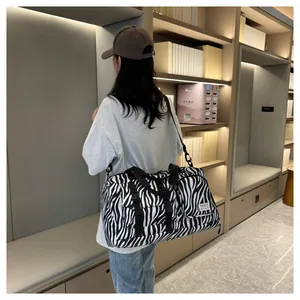 Stylish zebra print duffel bag with large capacity for travel and fitness training