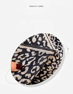Detailed macro view of leopard print silk-cotton blend scarf showing fabric texture