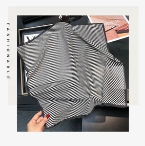 Detailed view of the breathable black and white striped silk-cotton square scarf