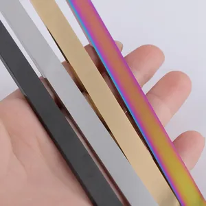 Detail view of mirror polished stainless steel strips in black, gold, silver, and rainbow.