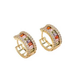 Elegant gold-plated copper hoop earrings with multicolor baguette zircons.