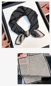 Elegant black and white striped silk square scarf with unique geometric pattern detail