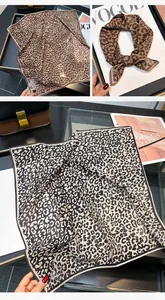 Detail view of lightweight leopard print silk-cotton square scarf with breathable texture