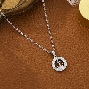 Close-up of a stainless steel anchor pendant necklace featuring inlaid clear rhinestones