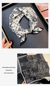 Detail view showing the elegant paisley pattern on a 55cm silk-cotton square scarf.