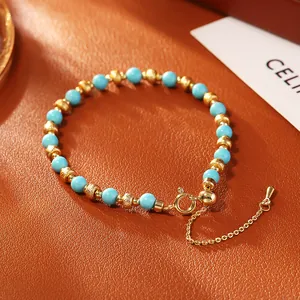 Elegant blue turquoise bead bracelet with gold plated textured accents and adjustable chain