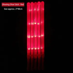 Close-up detail of five large red LED glow sticks for concerts and party events