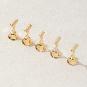 Five gold magnetic chess-shaped nail art display stands for press-on nail practice
