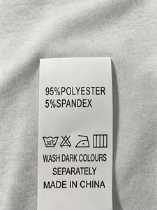 Detail view of clothing wash care label showing 95% polyester and 5% spandex