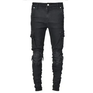 Men's stylish black skinny cargo jeans featuring ripped knees and pleated details