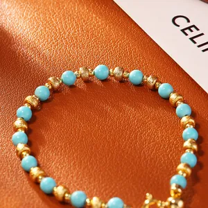 Elegant blue turquoise bracelet with gold-plated textured beads for women