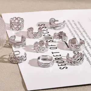Set of vintage silver stainless steel adjustable rings with bohemian patterns.