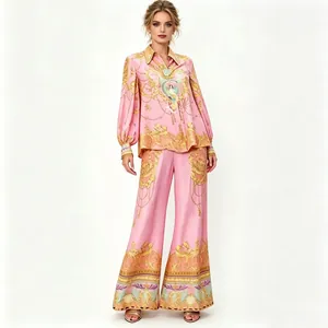 Detailed view of women's pink baroque print two-piece set with shirt and pants.