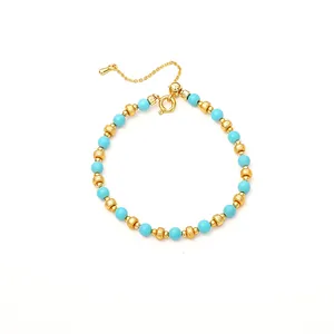 Elegant blue turquoise bead bracelet with gold-plated textured spacers and extender chain.